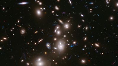 Bright lights scattered against a dark background. Some are round and bright. Others are small and dim.